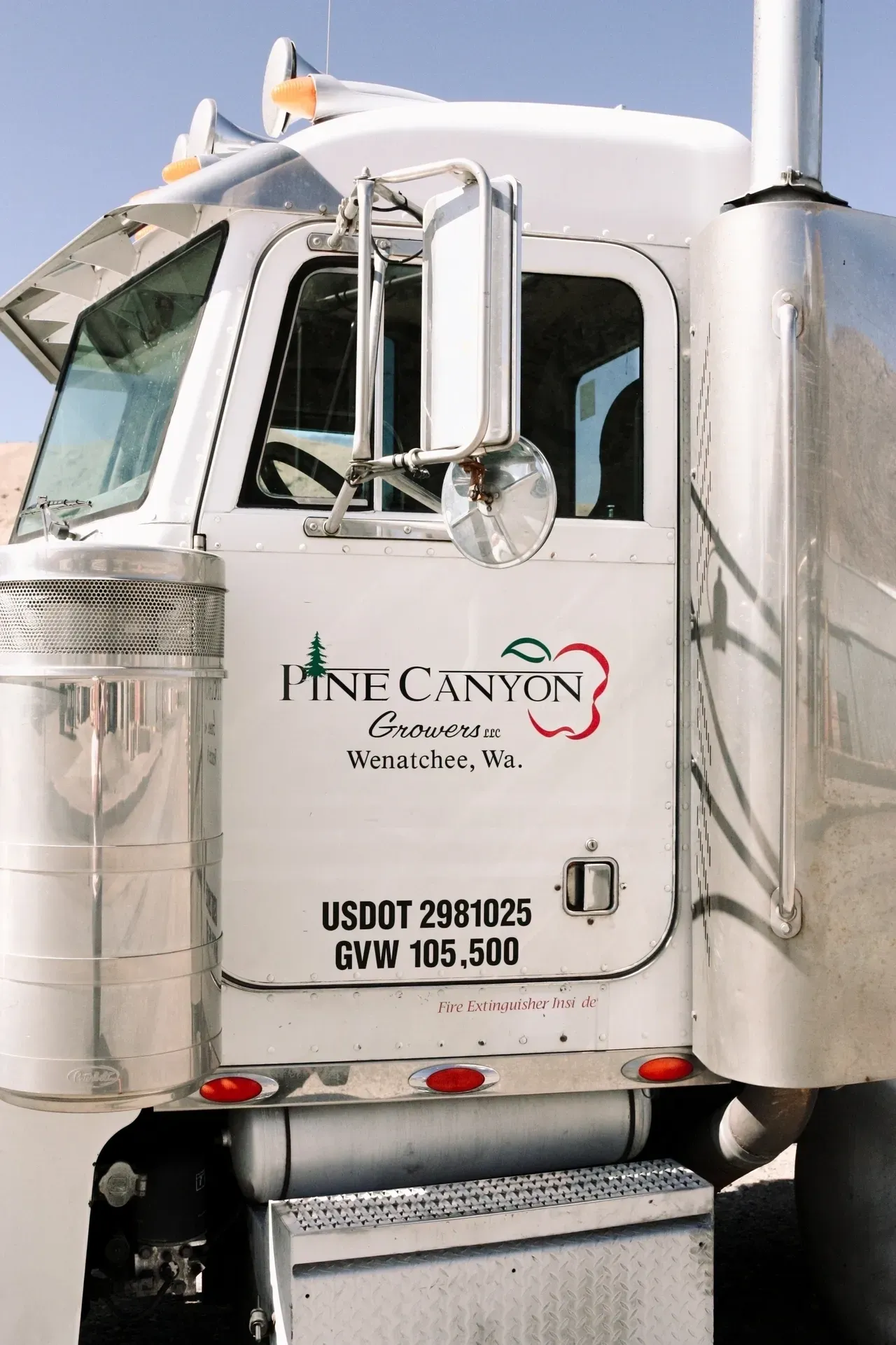 A large white truck with the words " fine canyon ".